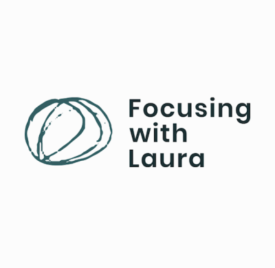 Logo with hand drawn circles and the words Focusing With Laura beside it in blue 