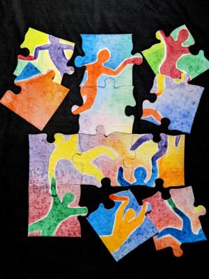colorful puzzle pieces with figures of people.