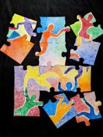colorful puzzle pieces with figures of people.